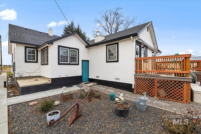 view of front of property with a wooden deck