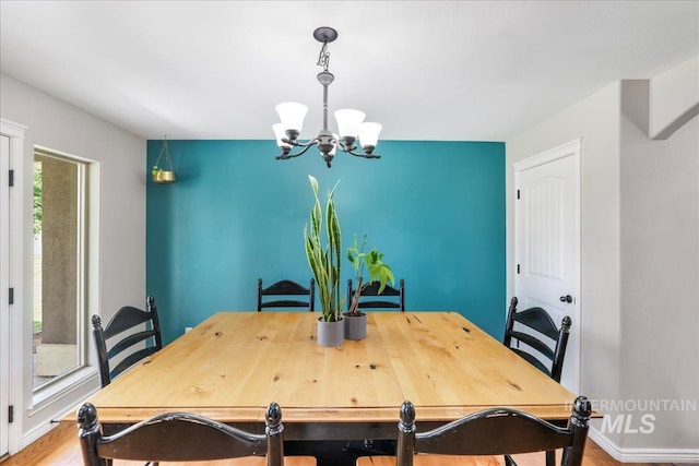 1021 Ballard Ln, Kimberly, ID 83341 - dining room with a chandelier and wood finished floors