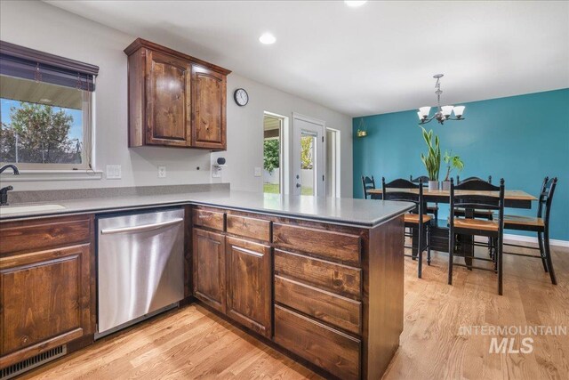 1021 Ballard Ln, Kimberly, ID 83341 - kitchen with stainless steel dishwasher, a peninsula, a chandelier, light wood-style floors, and recessed lighting