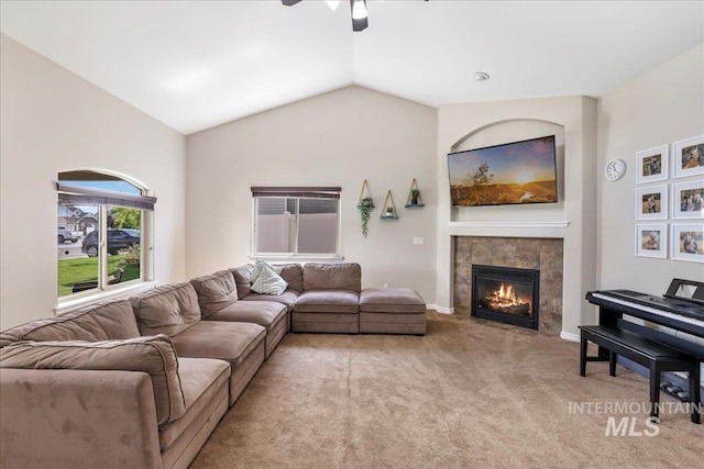 1021 Ballard Ln, Kimberly, ID 83341 - living area featuring light carpet, lofted ceiling, a fireplace, and ceiling fan