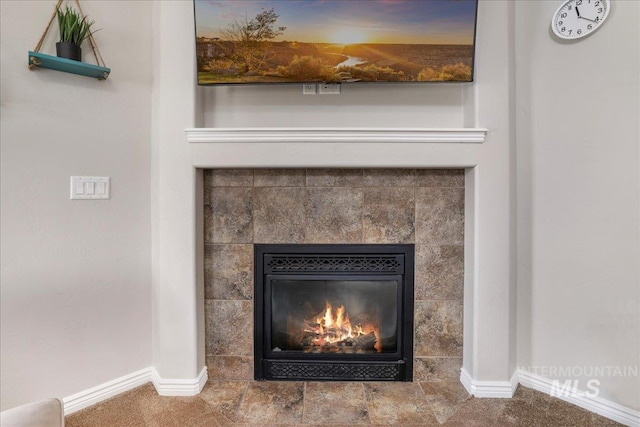1021 Ballard Ln, Kimberly, ID 83341 - detailed view of baseboards and a tiled fireplace