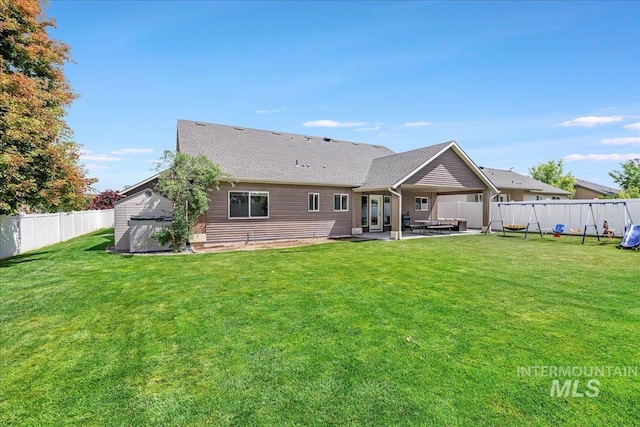1021 Ballard Ln, Kimberly, ID 83341 - rear view of property with a fenced backyard, a patio, and a storage unit