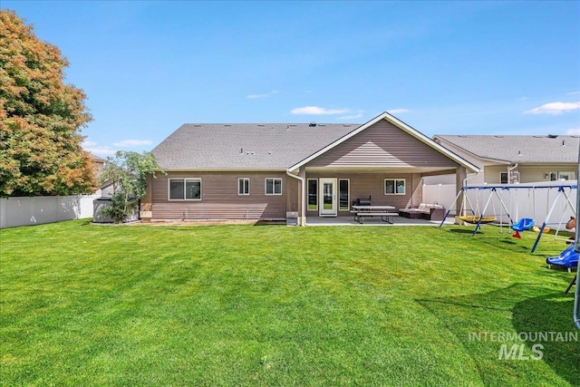 1021 Ballard Ln, Kimberly, ID 83341 - back of property featuring a patio, a fenced backyard, and outdoor lounge area