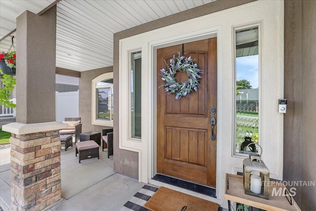 1021 Ballard Ln, Kimberly, ID 83341 - doorway to property with covered porch and stucco siding