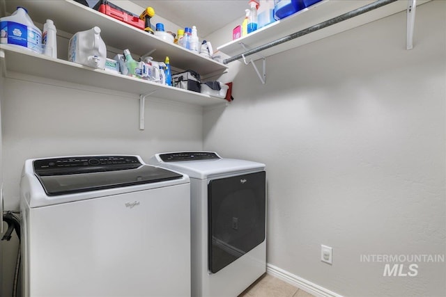 1021 Ballard Ln, Kimberly, ID 83341 - washroom featuring washer and clothes dryer and light tile patterned floors