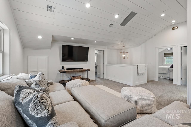 carpeted living room featuring wooden ceiling and vaulted ceiling