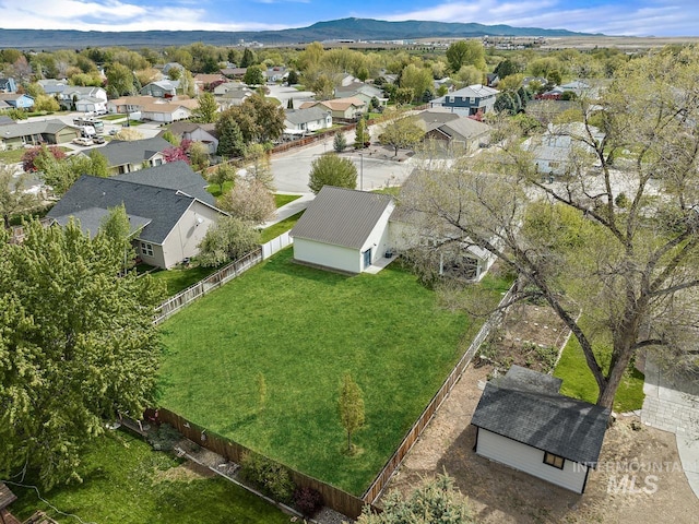 birds eye view of property with a mountain view