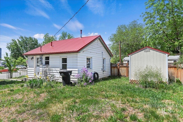 404 W 5th St, Weiser, ID 83672 - rear view of house with metal roof