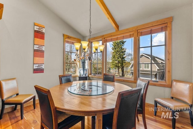 1391 Greystone Dr, Mccall, ID 83638 - dining area with wood finished floors, vaulted ceiling, a chandelier, and baseboards