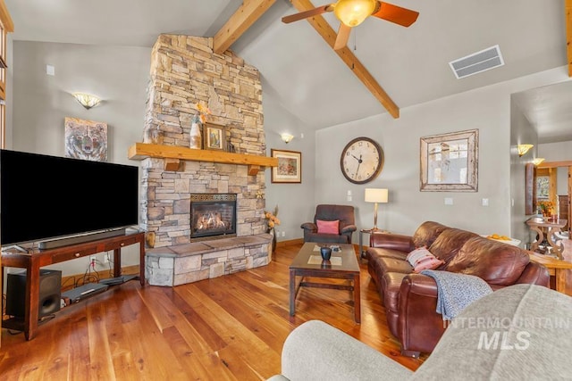 1391 Greystone Dr, Mccall, ID 83638 - living area with hardwood / wood-style floors, beam ceiling, ceiling fan, a fireplace, and baseboards