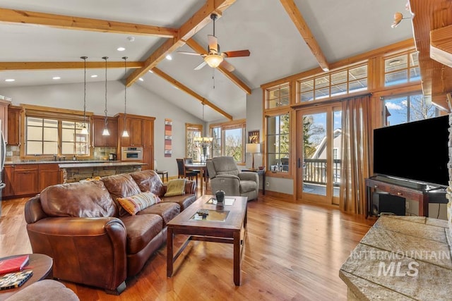 1391 Greystone Dr, Mccall, ID 83638 - living room with beamed ceiling, high vaulted ceiling, light wood finished floors, ceiling fan, and recessed lighting