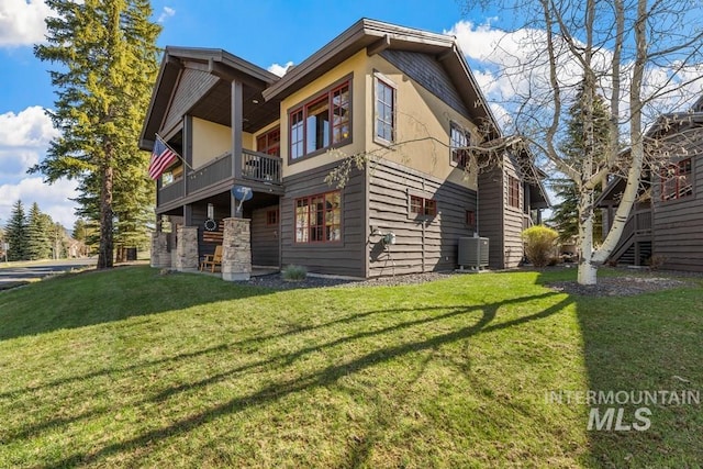 1391 Greystone Dr, Mccall, ID 83638 - rear view of house featuring a balcony, a yard, and central air condition unit