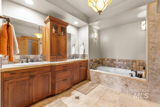 1391 Greystone Dr, Mccall, ID 83638 - bathroom featuring double vanity, a garden tub, tile patterned floors, recessed lighting, and tasteful backsplash