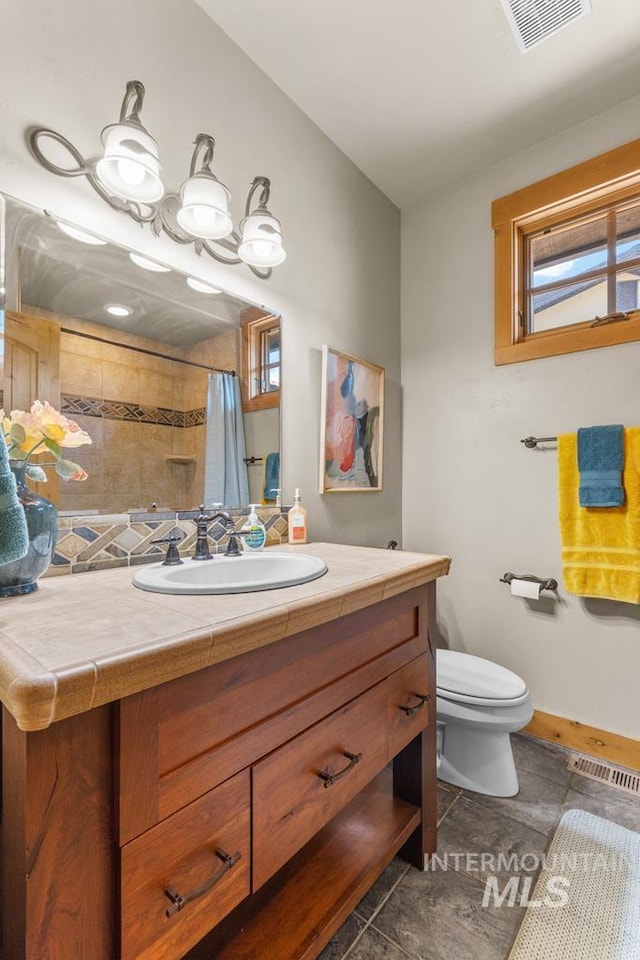 1391 Greystone Dr, Mccall, ID 83638 - full bathroom featuring toilet, vanity, a shower with curtain, and baseboards