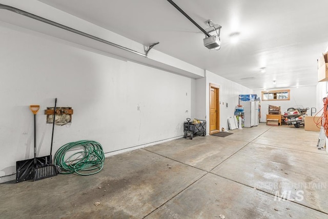 1391 Greystone Dr, Mccall, ID 83638 - garage featuring a garage door opener