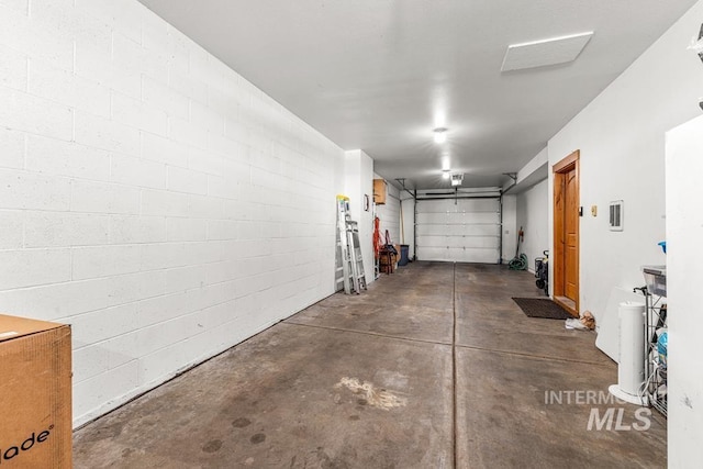 1391 Greystone Dr, Mccall, ID 83638 - garage featuring concrete block wall and a garage door opener