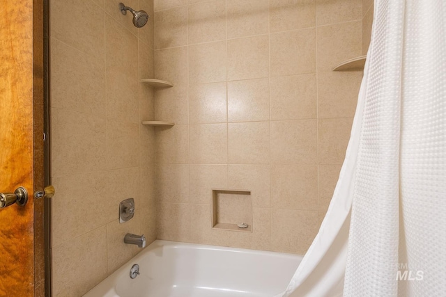 bathroom featuring shower / bath combo with shower curtain