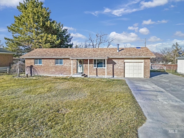 ranch-style house featuring a front lawn and a garage