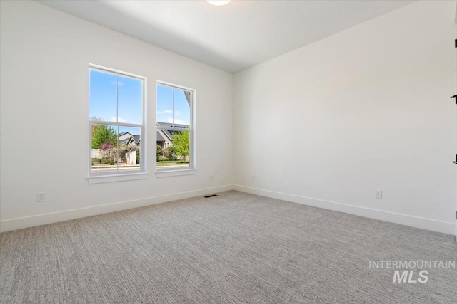 2391 E Snocreek Dr, Eagle, ID 83616 - spare room with baseboards, light carpet, and visible vents