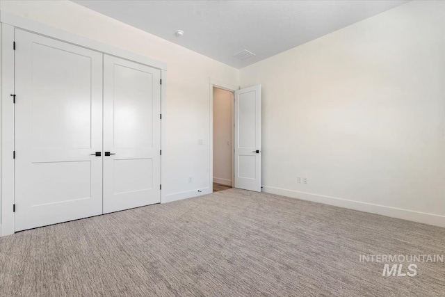 2391 E Snocreek Dr, Eagle, ID 83616 - unfurnished bedroom with baseboards, carpet floors, and a closet