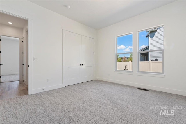 2391 E Snocreek Dr, Eagle, ID 83616 - unfurnished bedroom with recessed lighting, baseboards, visible vents, and carpet