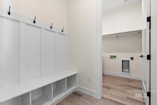 2391 E Snocreek Dr, Eagle, ID 83616 - mudroom with light wood-type flooring and baseboards