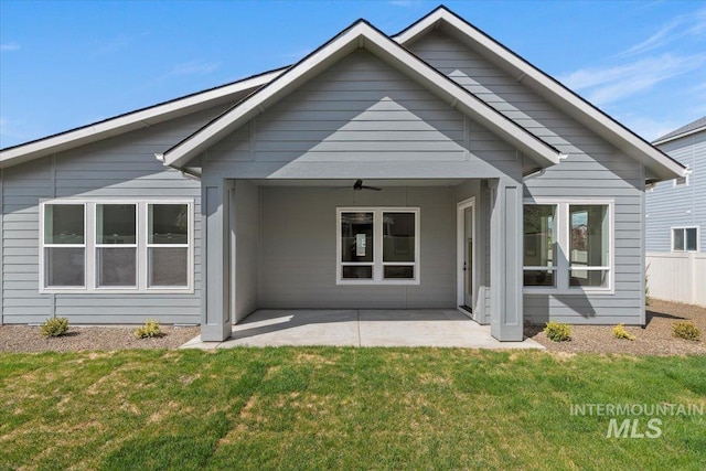 2391 E Snocreek Dr, Eagle, ID 83616 - back of property with a lawn, a ceiling fan, and a patio area