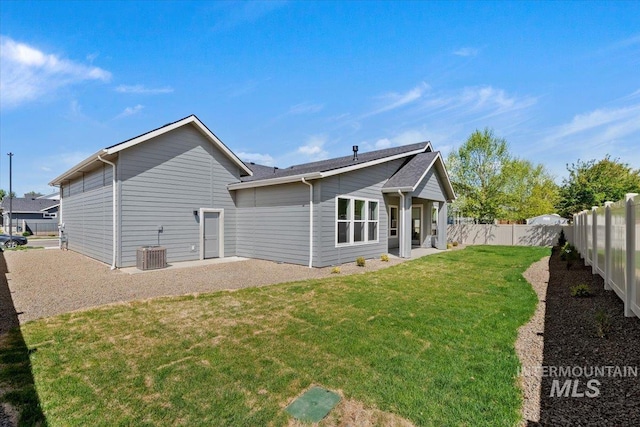 2391 E Snocreek Dr, Eagle, ID 83616 - back of property featuring a patio, a fenced backyard, a yard, and central AC unit