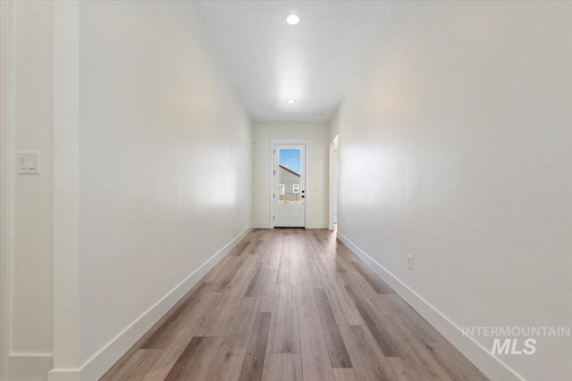 2391 E Snocreek Dr, Eagle, ID 83616 - hall featuring light wood-style floors and baseboards