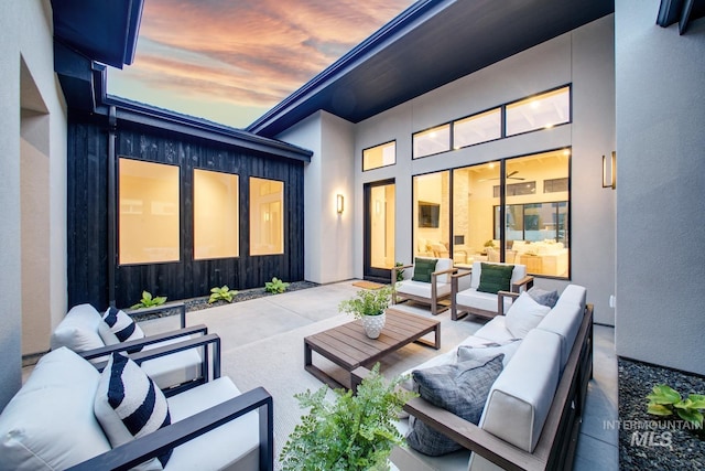 6241 W Strant St, Eagle, ID 83616 - patio terrace at dusk with an outdoor living space and a patio