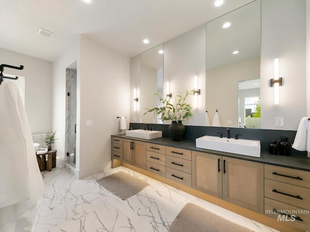 6241 W Strant St, Eagle, ID 83616 - bathroom featuring double vanity, marble finish floors, a marble finish shower, and recessed lighting
