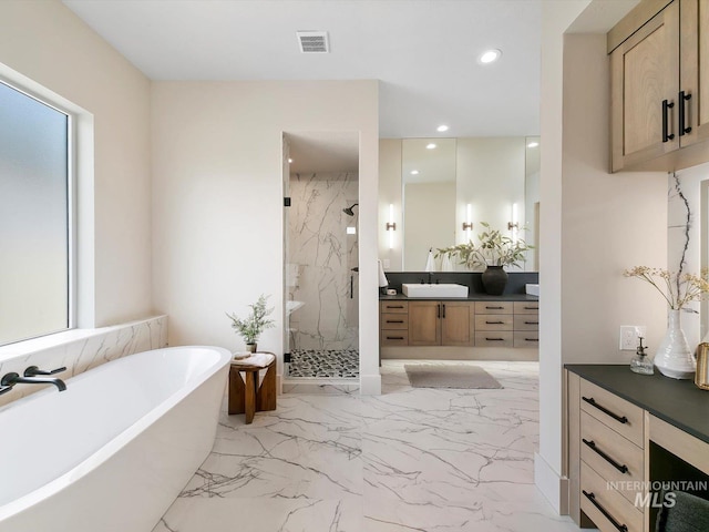 6241 W Strant St, Eagle, ID 83616 - full bathroom featuring marble finish floors, vanity, a marble finish shower, recessed lighting, and a freestanding bath