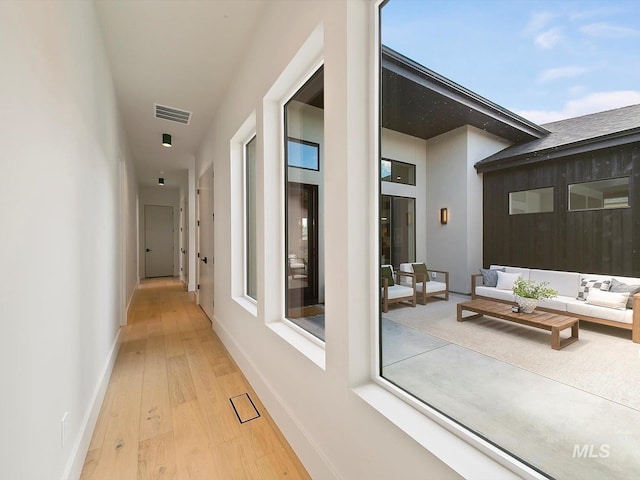 6241 W Strant St, Eagle, ID 83616 - hallway featuring wood-type flooring and baseboards