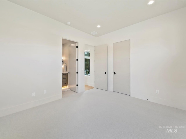 6241 W Strant St, Eagle, ID 83616 - unfurnished bedroom featuring recessed lighting, baseboards, light carpet, and ensuite bathroom