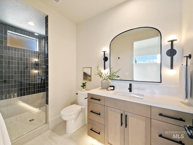 6241 W Strant St, Eagle, ID 83616 - full bathroom with vanity, toilet, a stall shower, and tile patterned flooring