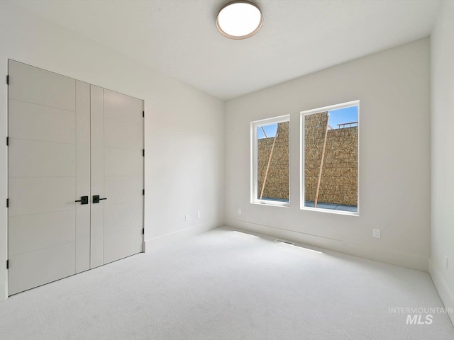 6241 W Strant St, Eagle, ID 83616 - unfurnished bedroom featuring carpet flooring, a closet, and baseboards