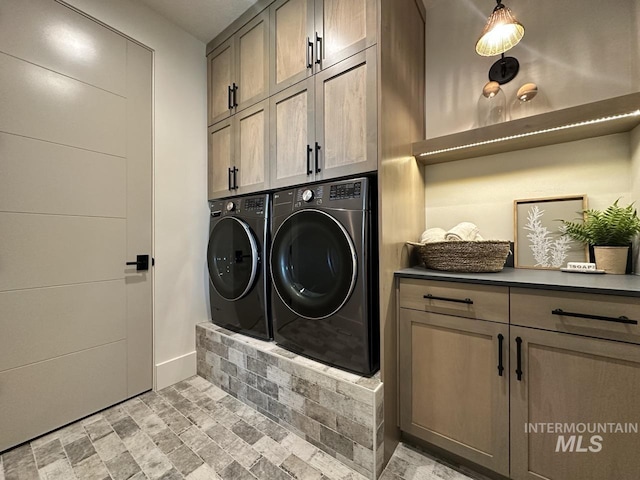 6241 W Strant St, Eagle, ID 83616 - laundry room with cabinet space, washer and clothes dryer, and baseboards