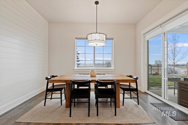 dining space featuring dark hardwood / wood-style flooring