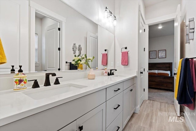 bathroom featuring vanity and wood-type flooring