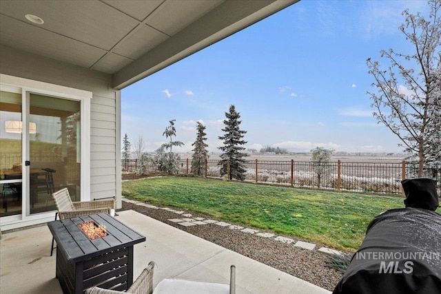 view of patio / terrace with a fire pit