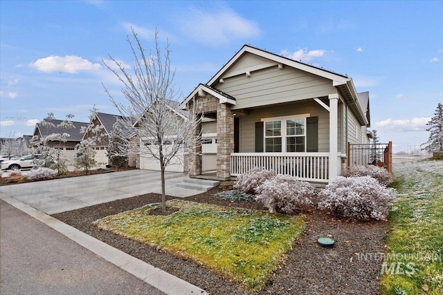 view of front of house with a garage and covered porch