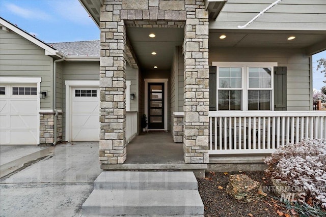 doorway to property with a garage