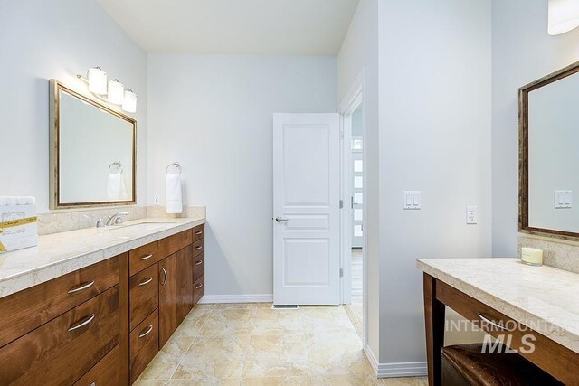 bathroom with vanity and baseboards