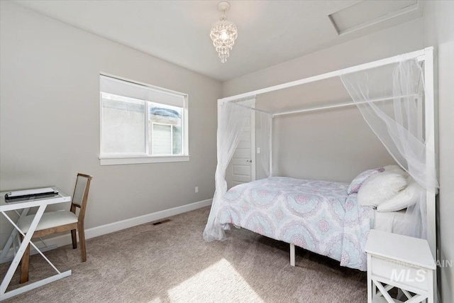 carpeted bedroom with baseboards and visible vents