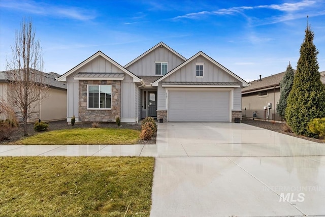 craftsman inspired home featuring concrete driveway, an attached garage, board and batten siding, a front yard, and stone siding