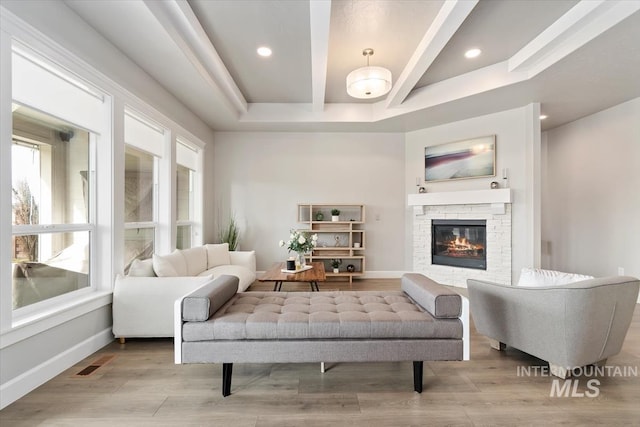 sitting room with recessed lighting, a fireplace, wood finished floors, visible vents, and baseboards