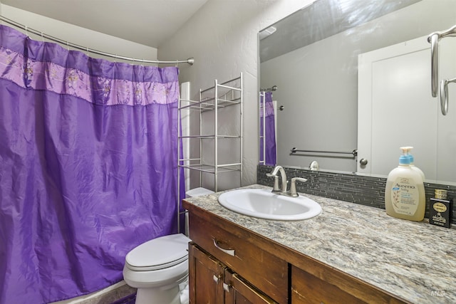 bathroom featuring backsplash, toilet, vanity, and curtained shower