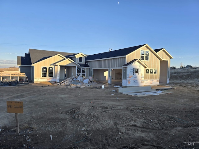 unfinished property featuring a garage