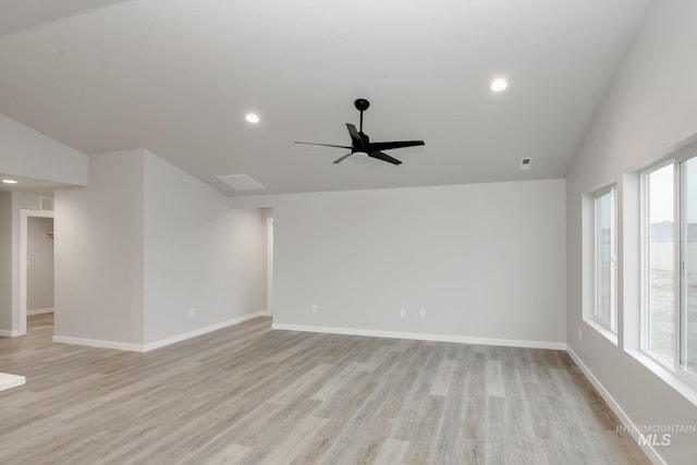 empty room with baseboards and light wood-style floors