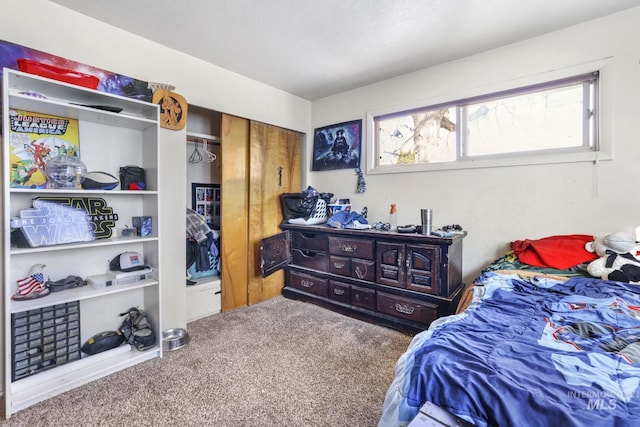 carpeted bedroom featuring a closet